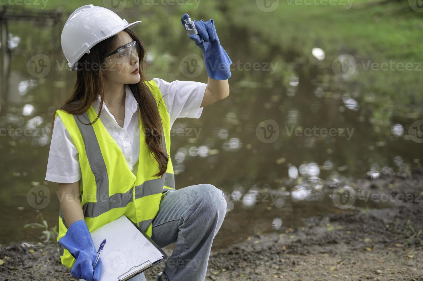 Environmental engineers inspect water quality,Bring water to the lab for testing,Check the mineral content in water and soil,Check for contaminants in water sources. photo