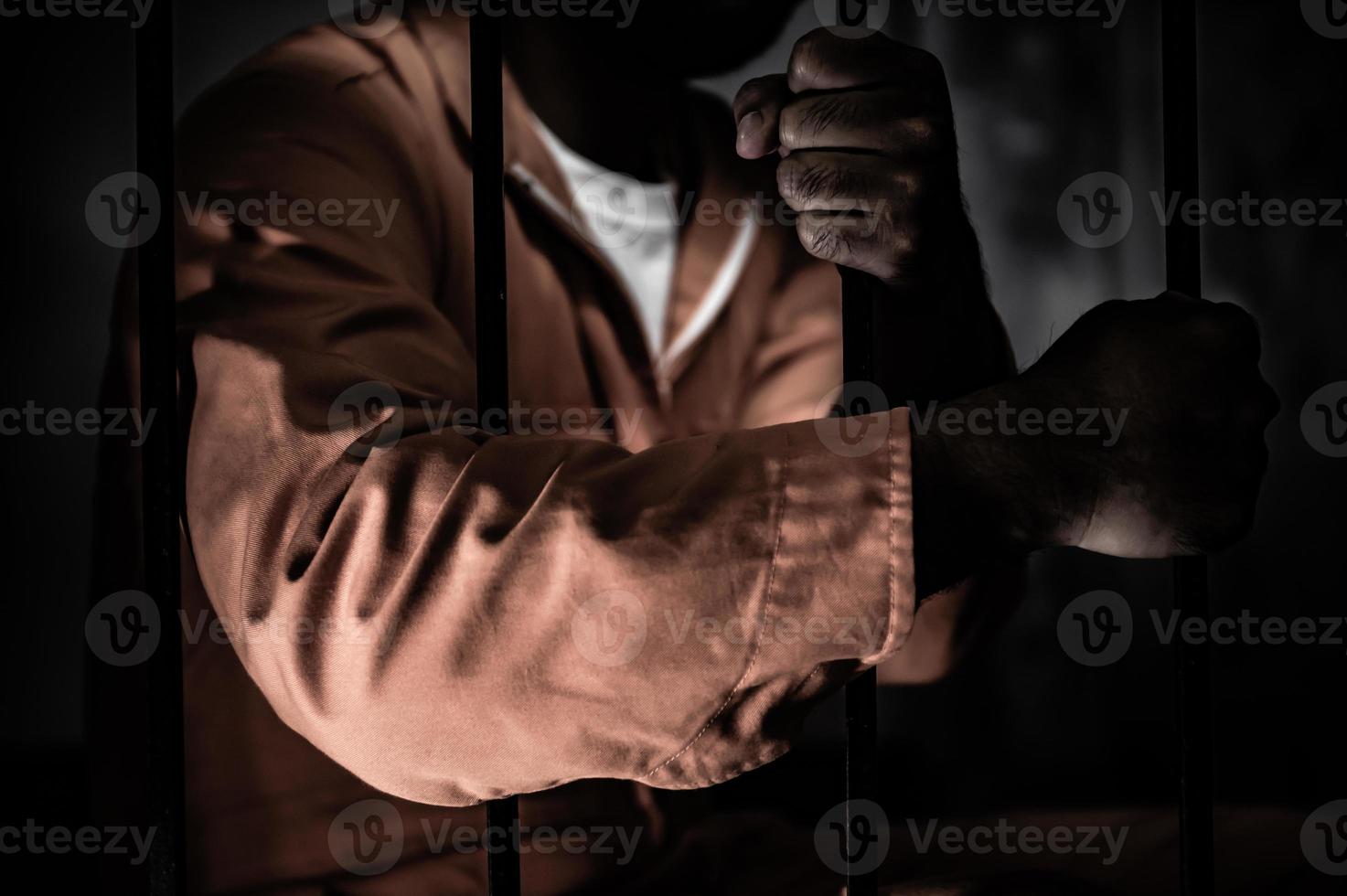 Asian man desperate at the iron prison,prisoner concept,thailand people,Hope to be free,Serious prisoners imprisoned in the prison photo