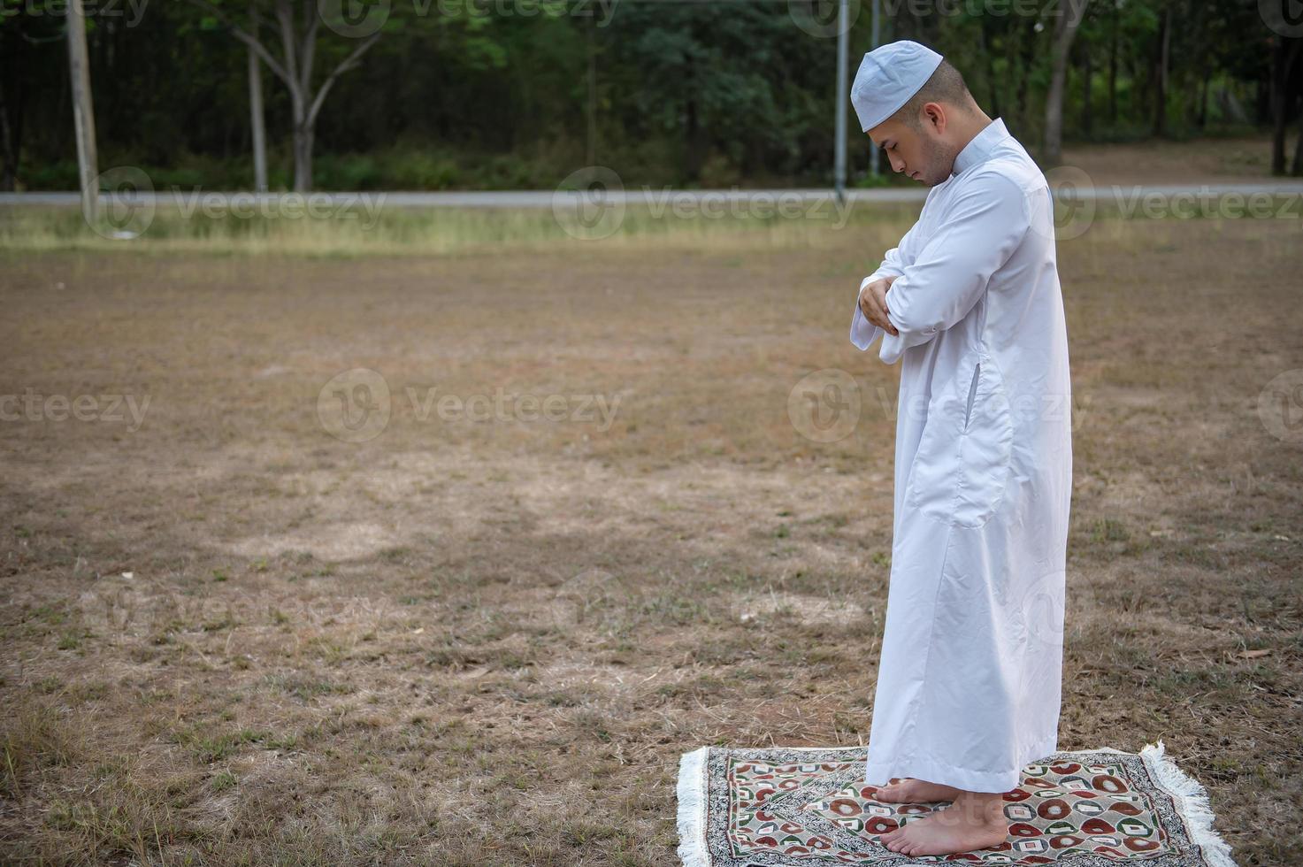 Asian islam man prayer,Young Muslim praying,Ramadan festival concept photo