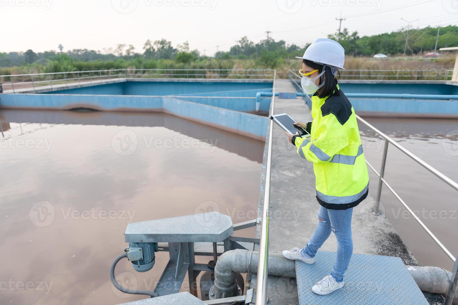 Environmental engineers work at wastewater treatment plants,Water supply engineering working at Water recycling plant for reuse photo