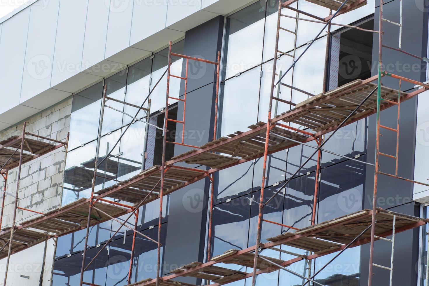 Scaffolding installed along the facade of the building photo