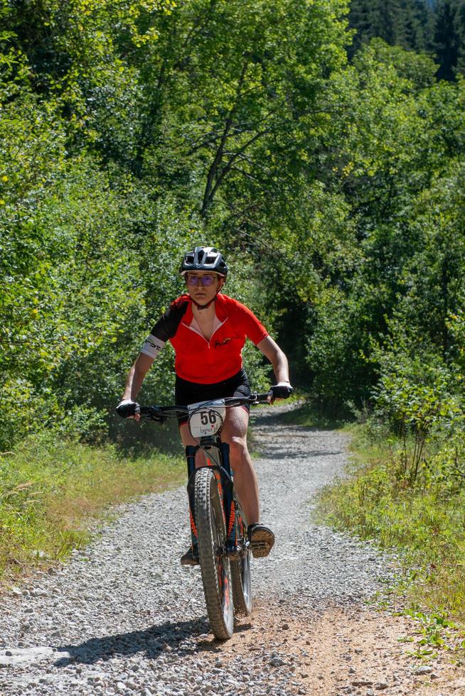 Italy  2022 Cyclists traveling on challenging trails on mountain bikes photo