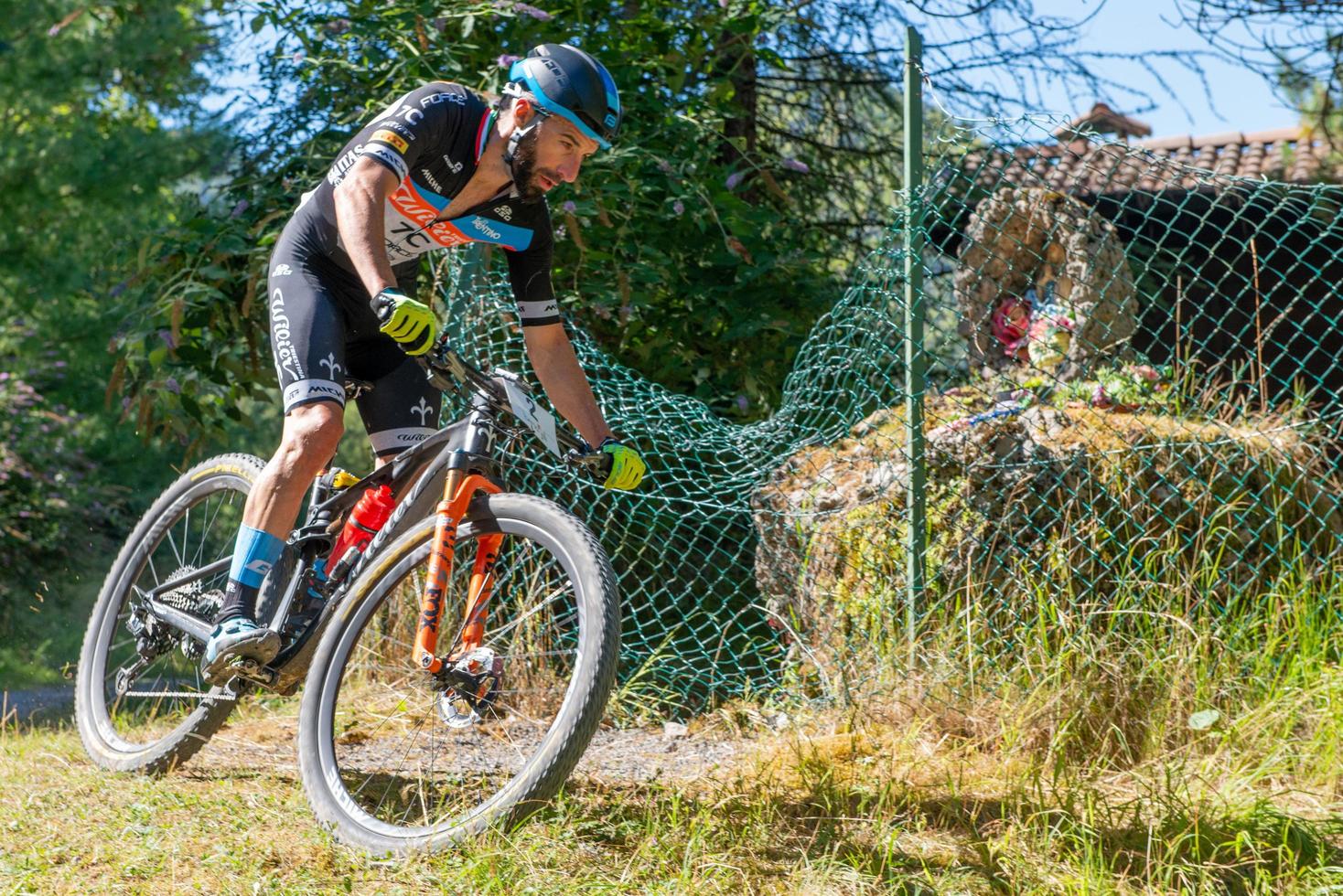 Italy  2022 Cyclists traveling on challenging trails on mountain bikes photo