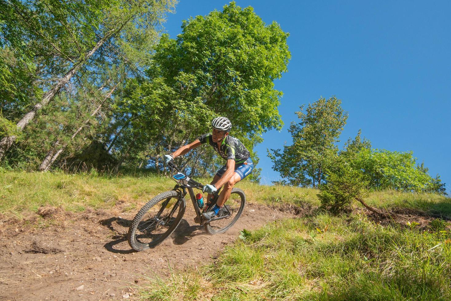 Italy  2022 Cyclists traveling on challenging trails on mountain bikes photo
