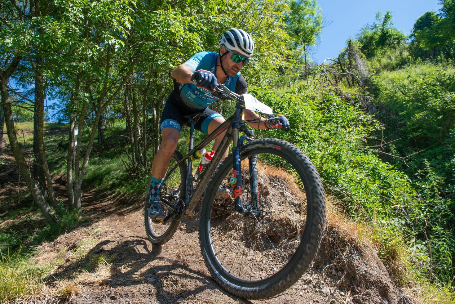 Italy  2022 Cyclists traveling on challenging trails on mountain bikes photo