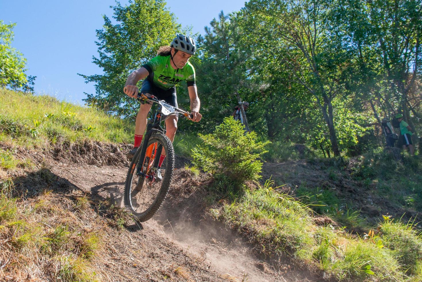 Italy  2022 Cyclists traveling on challenging trails on mountain bikes photo
