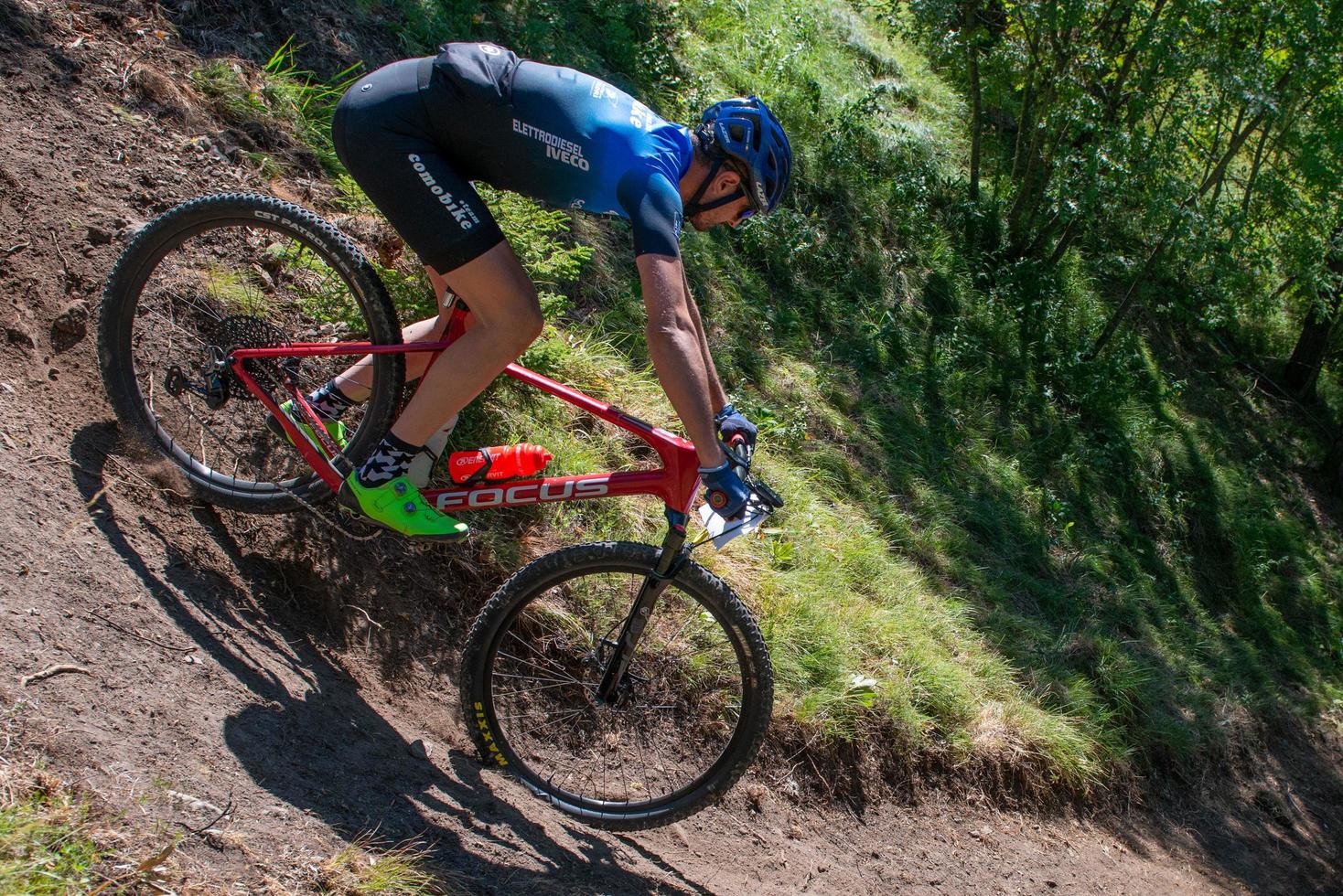 Italy  2022 Cyclists traveling on challenging trails on mountain bikes photo