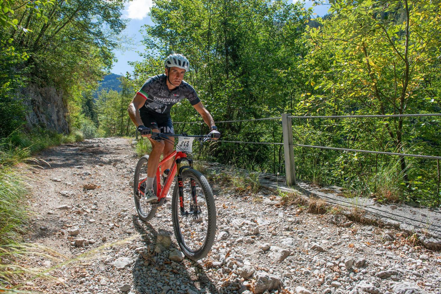 Italy  2022 Cyclists traveling on challenging trails on mountain bikes photo