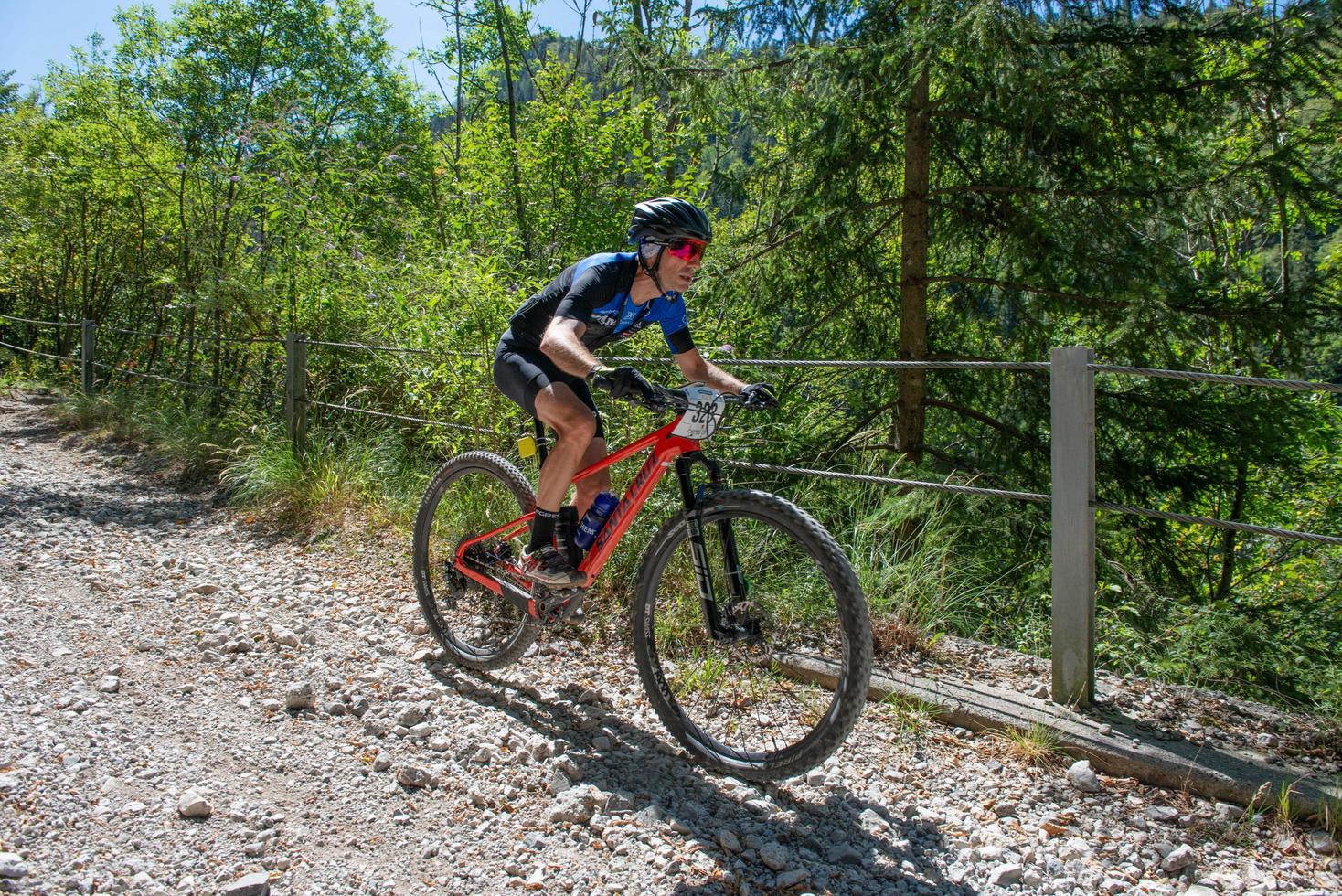 Italy  2022 Cyclists traveling on challenging trails on mountain bikes photo