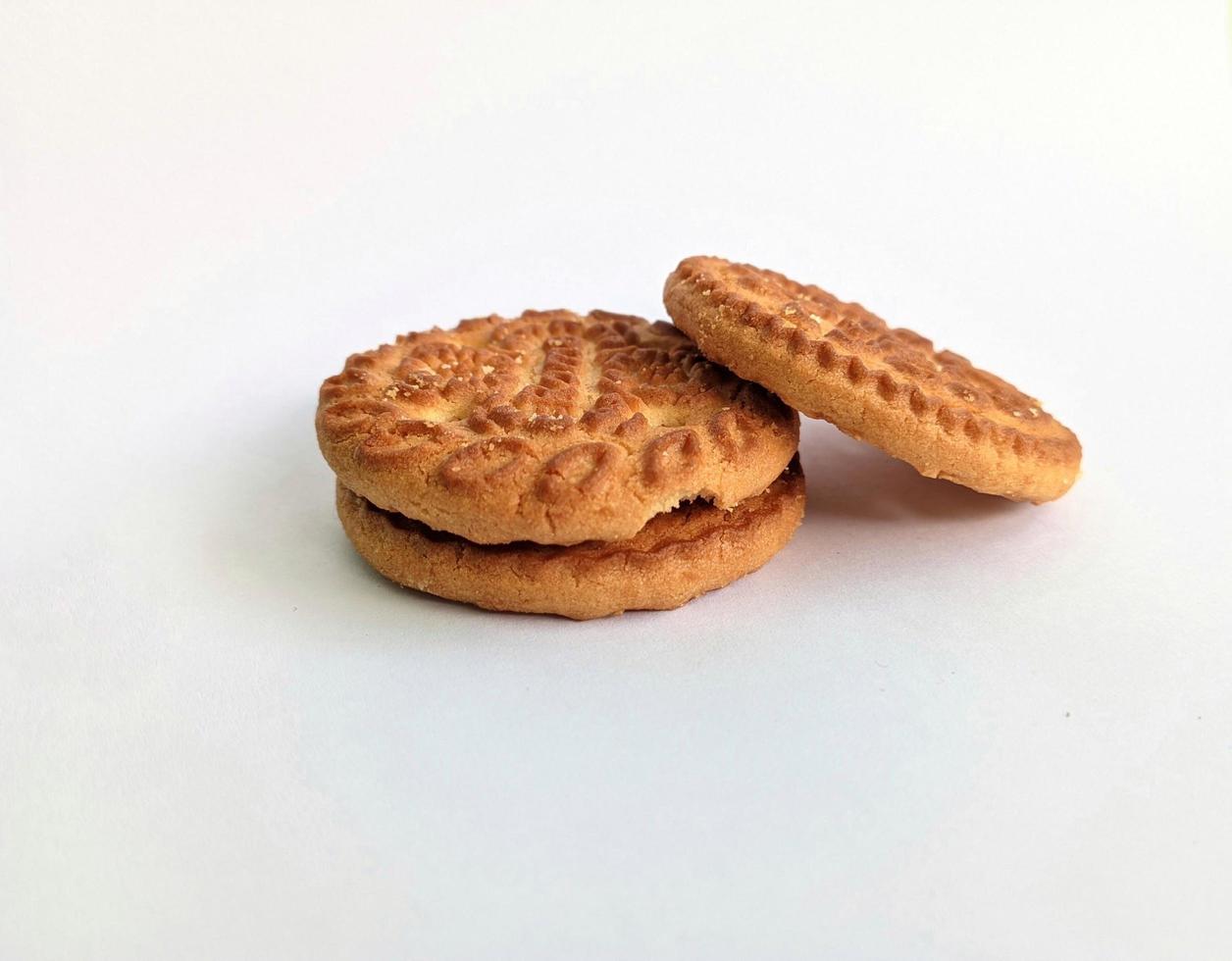 Pile of delicious roma biscuits isolated on white background. photo