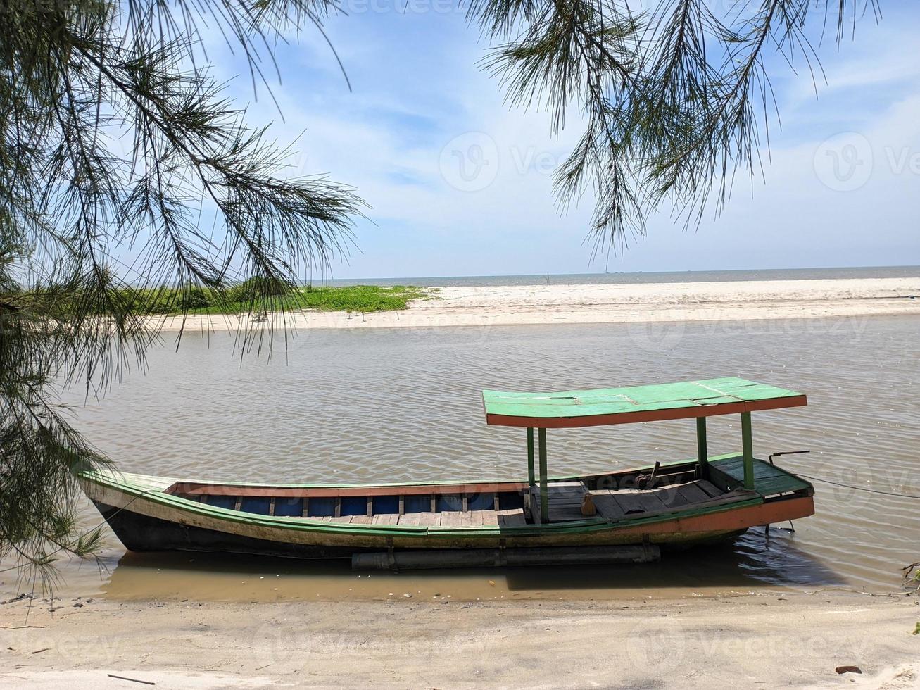 old canoe or boat by the river photo