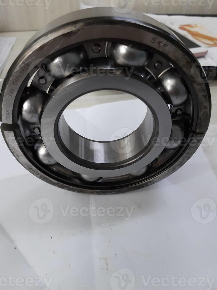 Damaged bearings on the table, industrial machinery parts photo