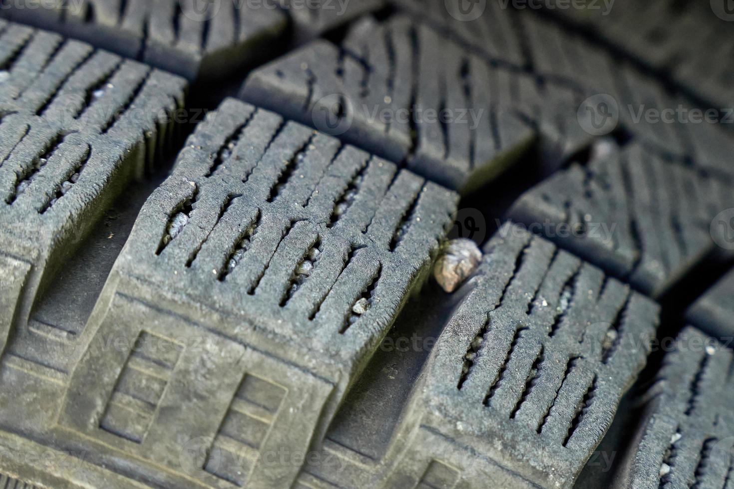 Pebbles stuck in tread of car tire. 10454611 Stock Photo at Vecteezy