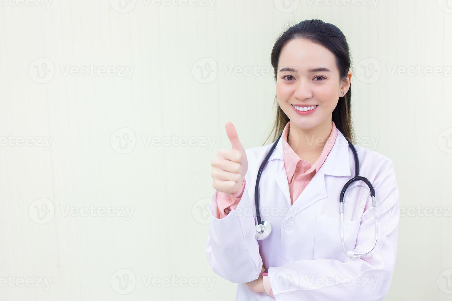 Asian young woman doctor who wears medical uniform photo