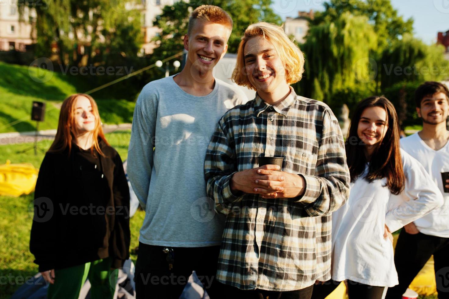 Young multi ethnic group of people in open air cinema. photo