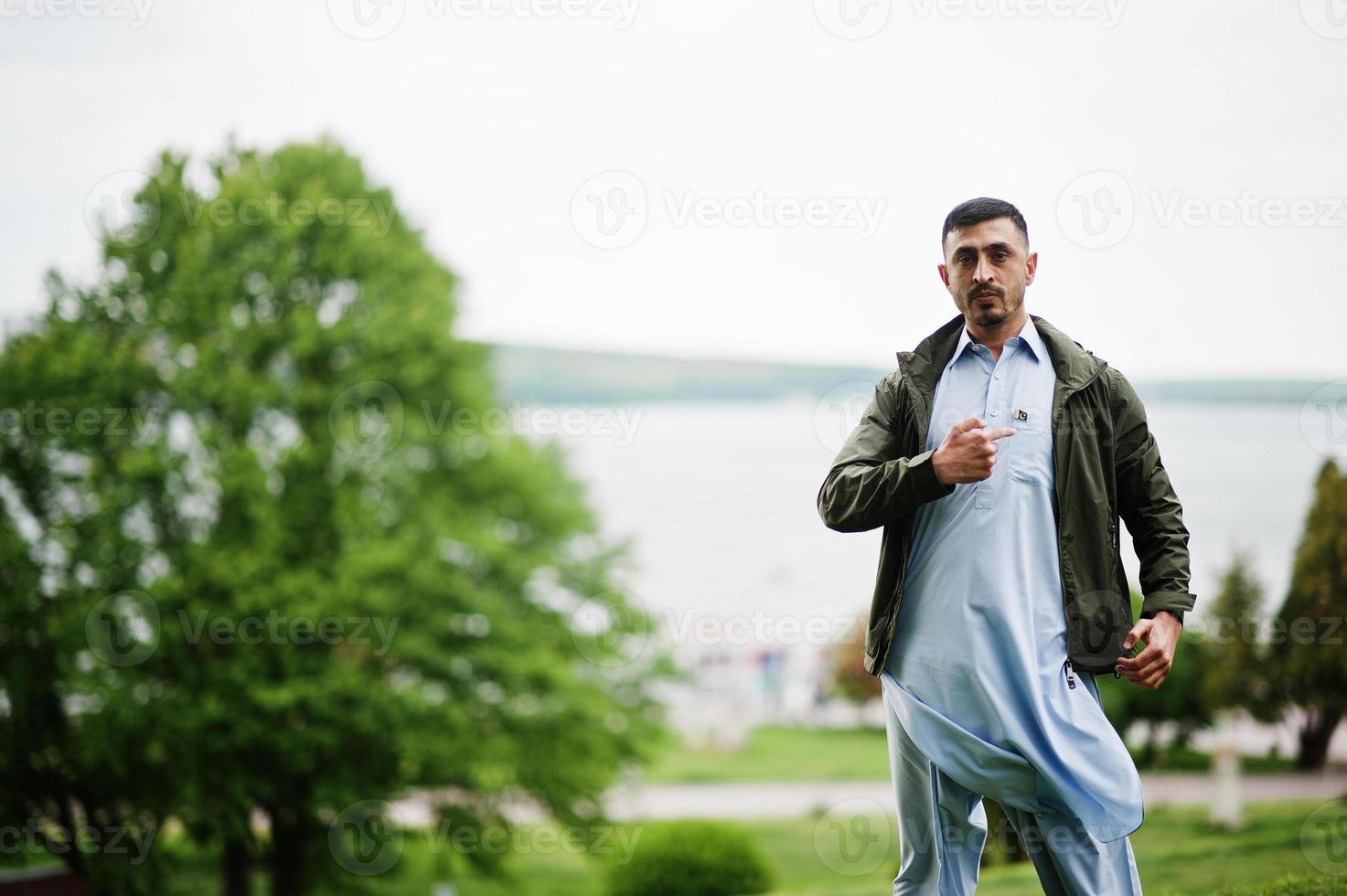 Traditional clothes indian pakistan male portrait. photo