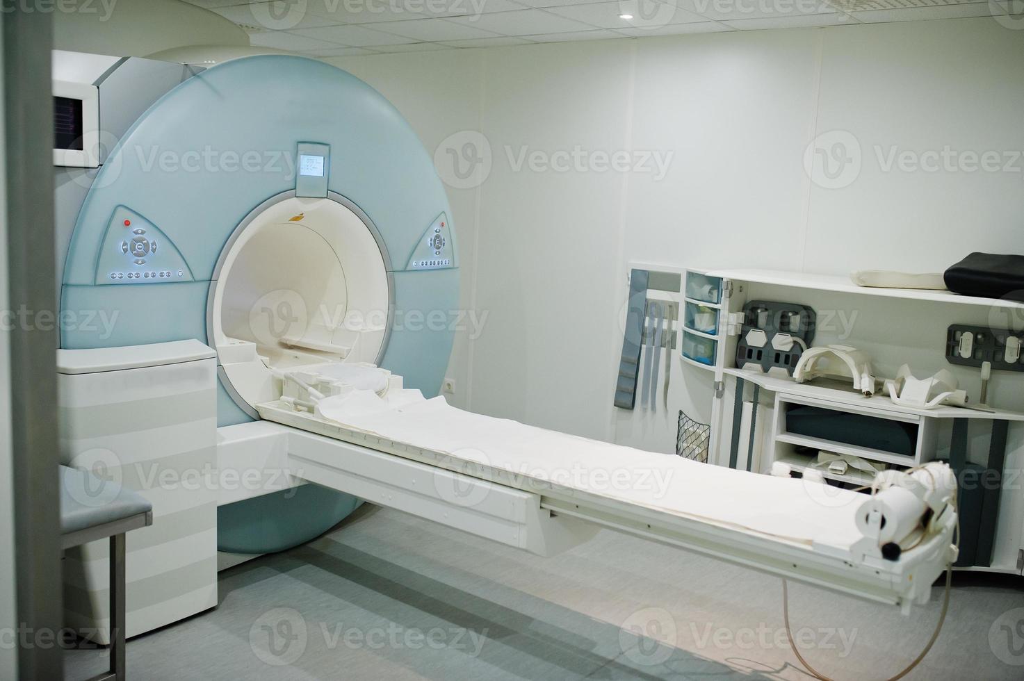 Magnetic resonance imaging scan or MRI machine device in hospital. photo