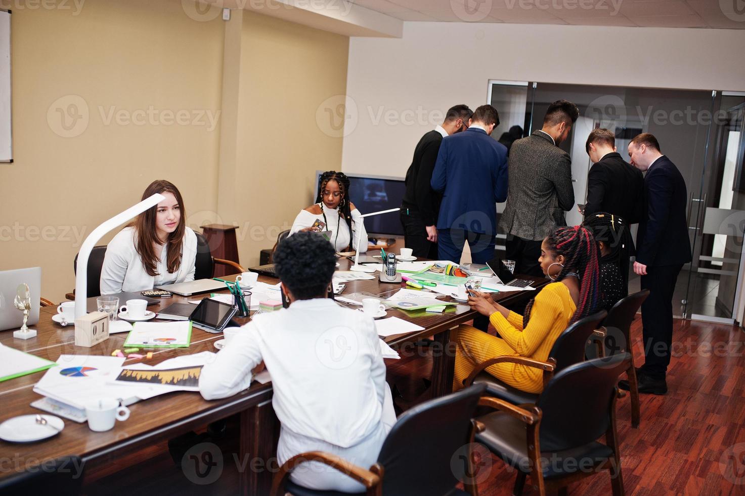 Diverse business people on a meeting at round table. photo