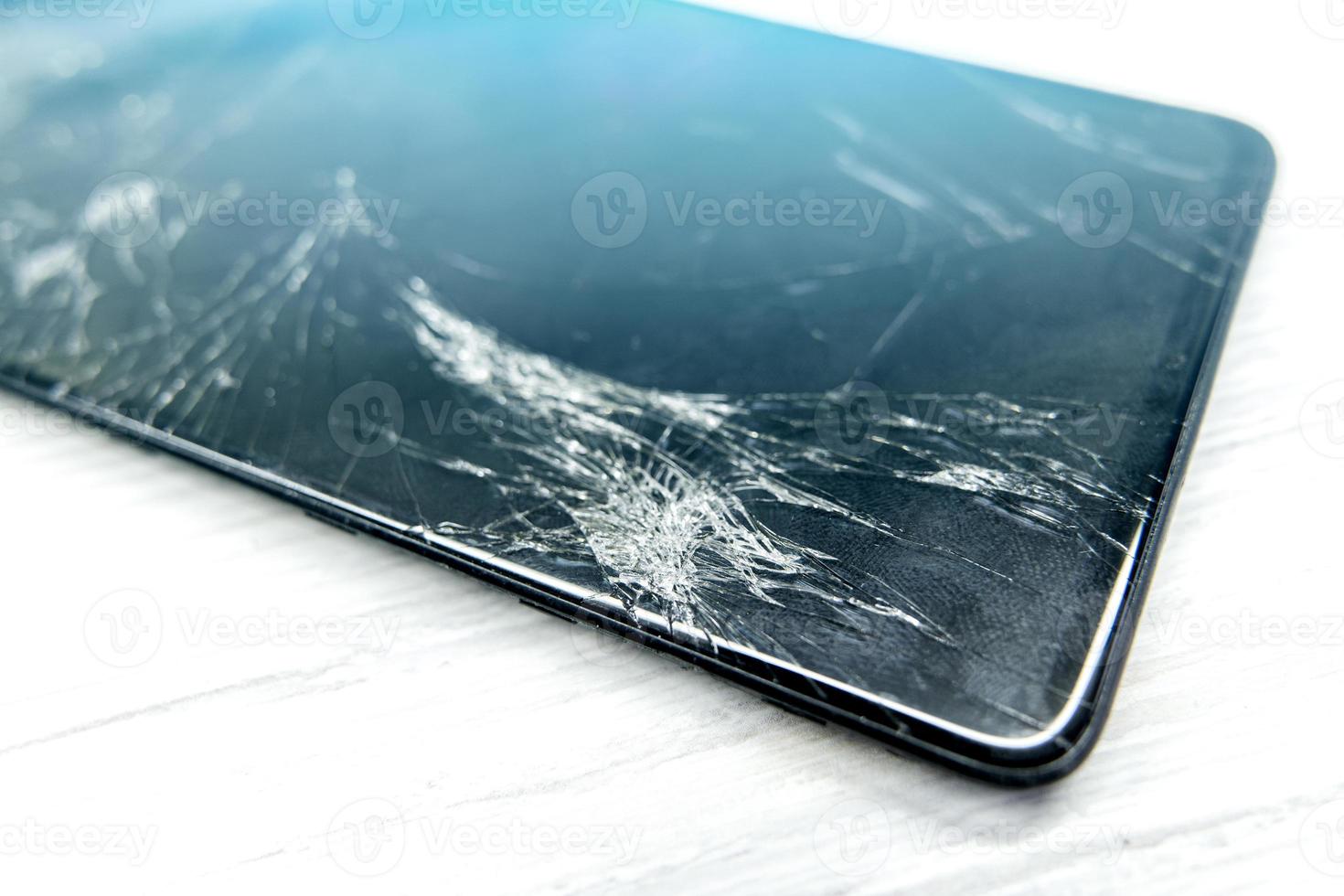 a broken mobile phone screen in the master's hand photo