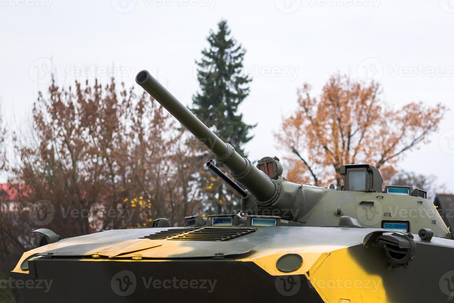 green military tank ready to battle with guns photo