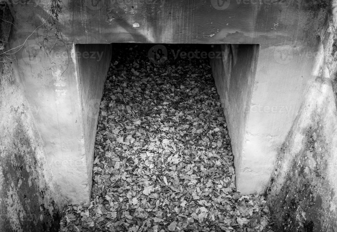 Greyscale image of an old concrete culvert photo