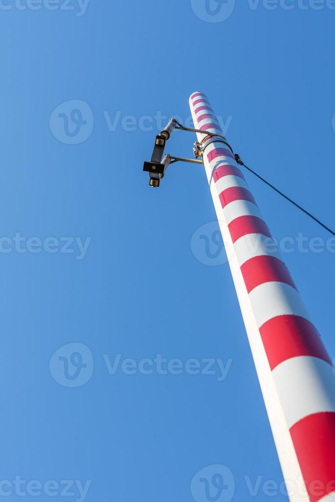 a railway barrier with a view from below photo