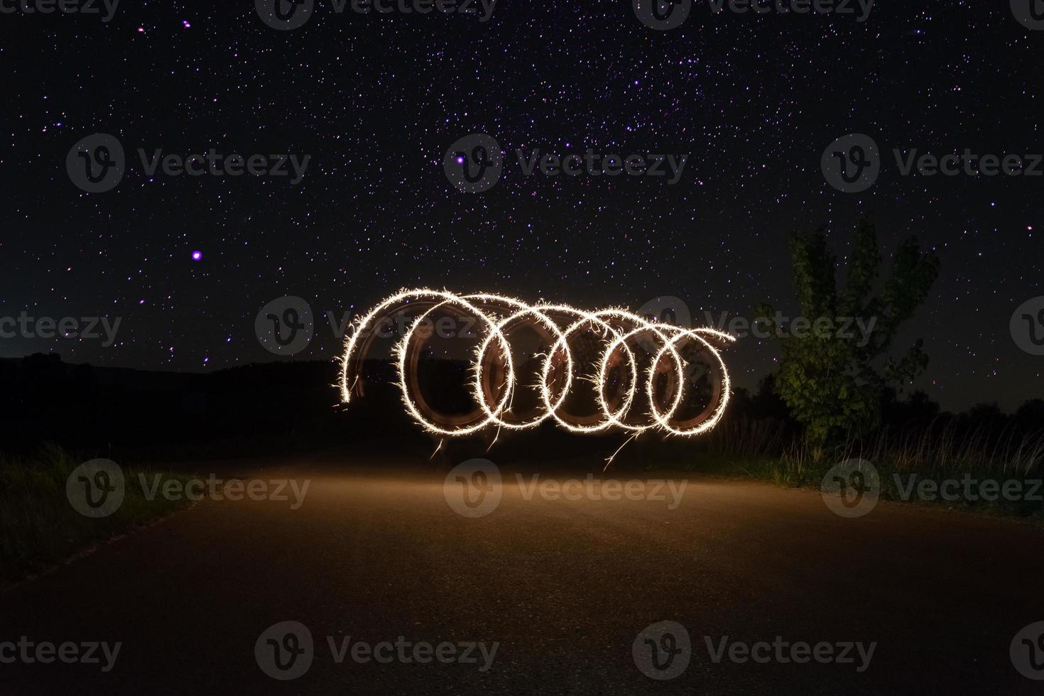 Spiral flame of night fire show photo