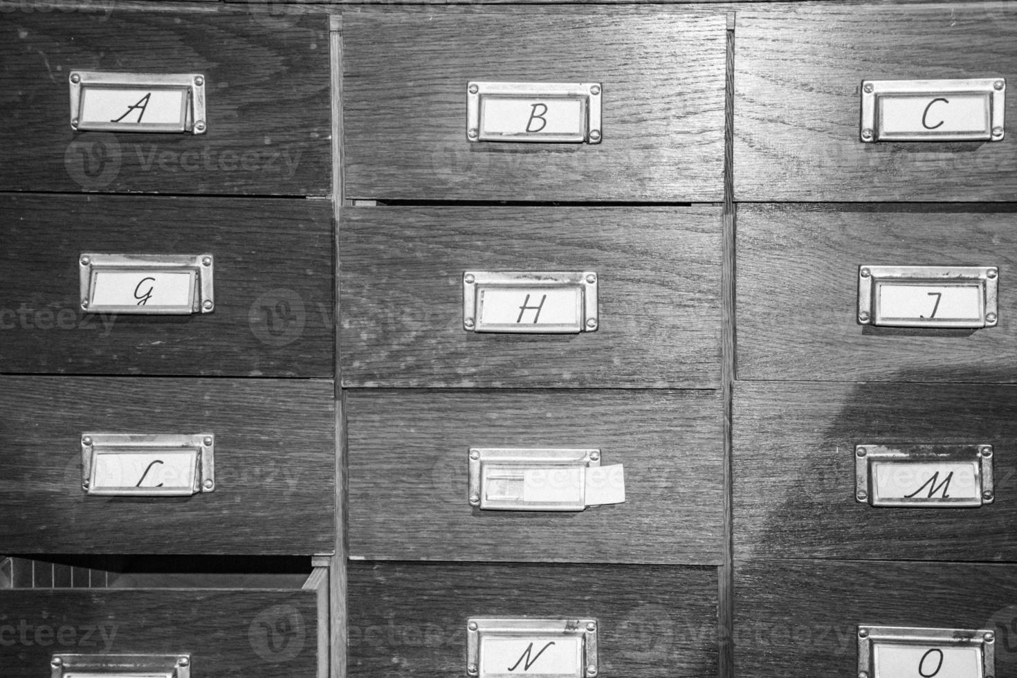 Wooden cabinet of drawers labelled with letters photo