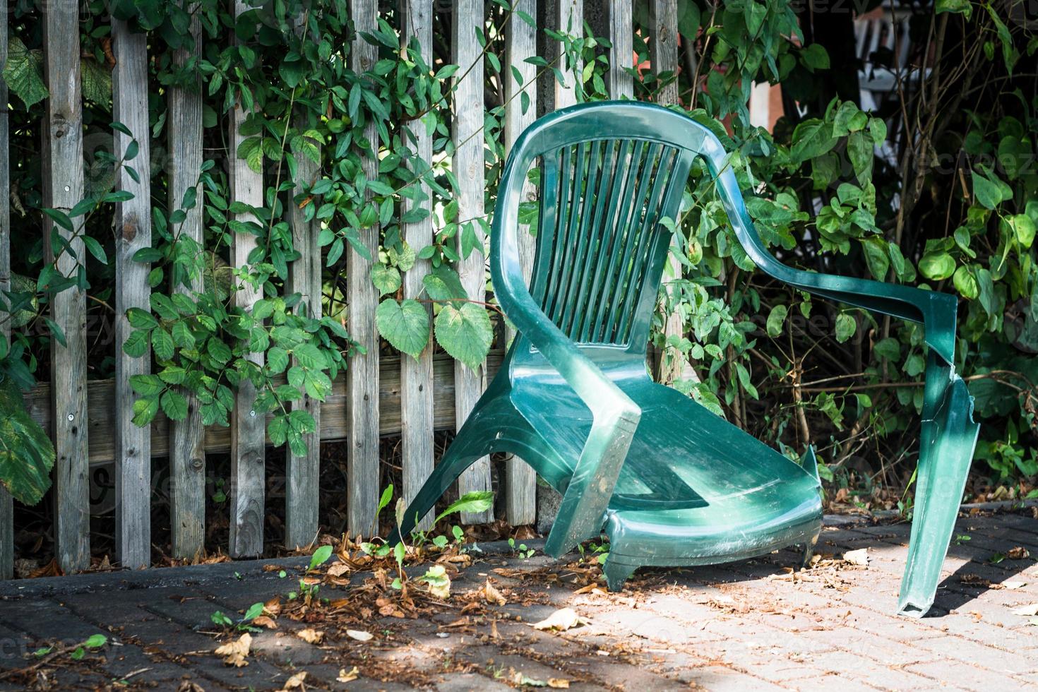 broken green garden chair photo