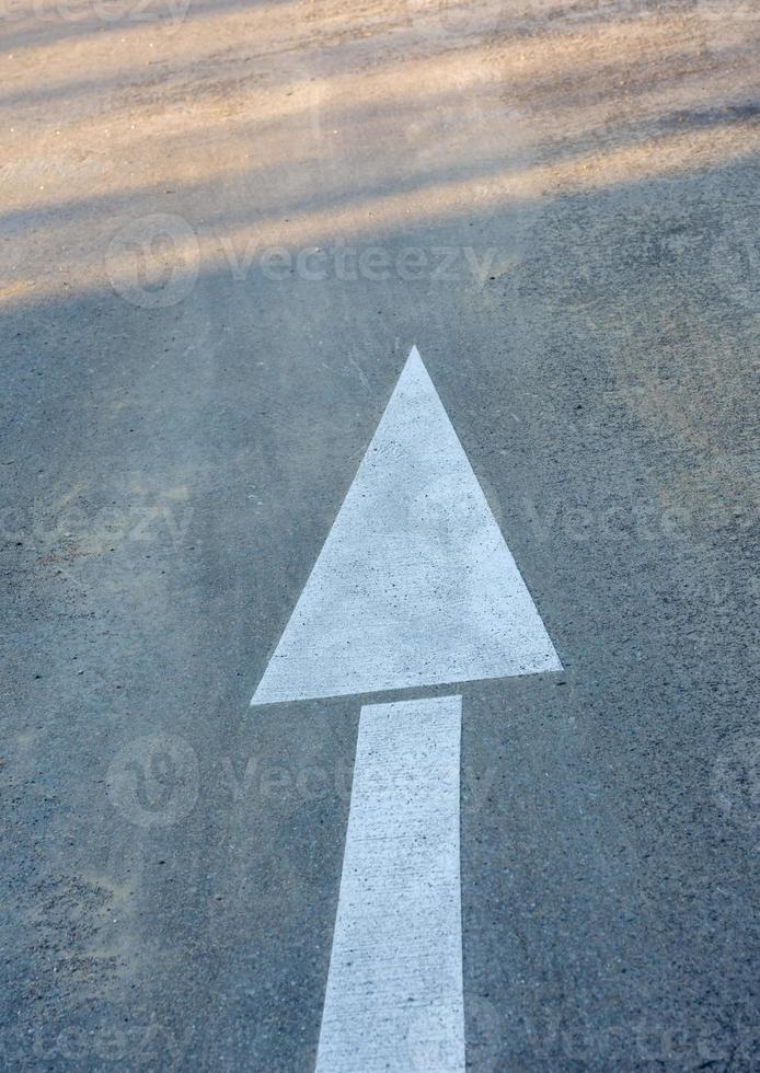 Moving Forward arrow on the road photo
