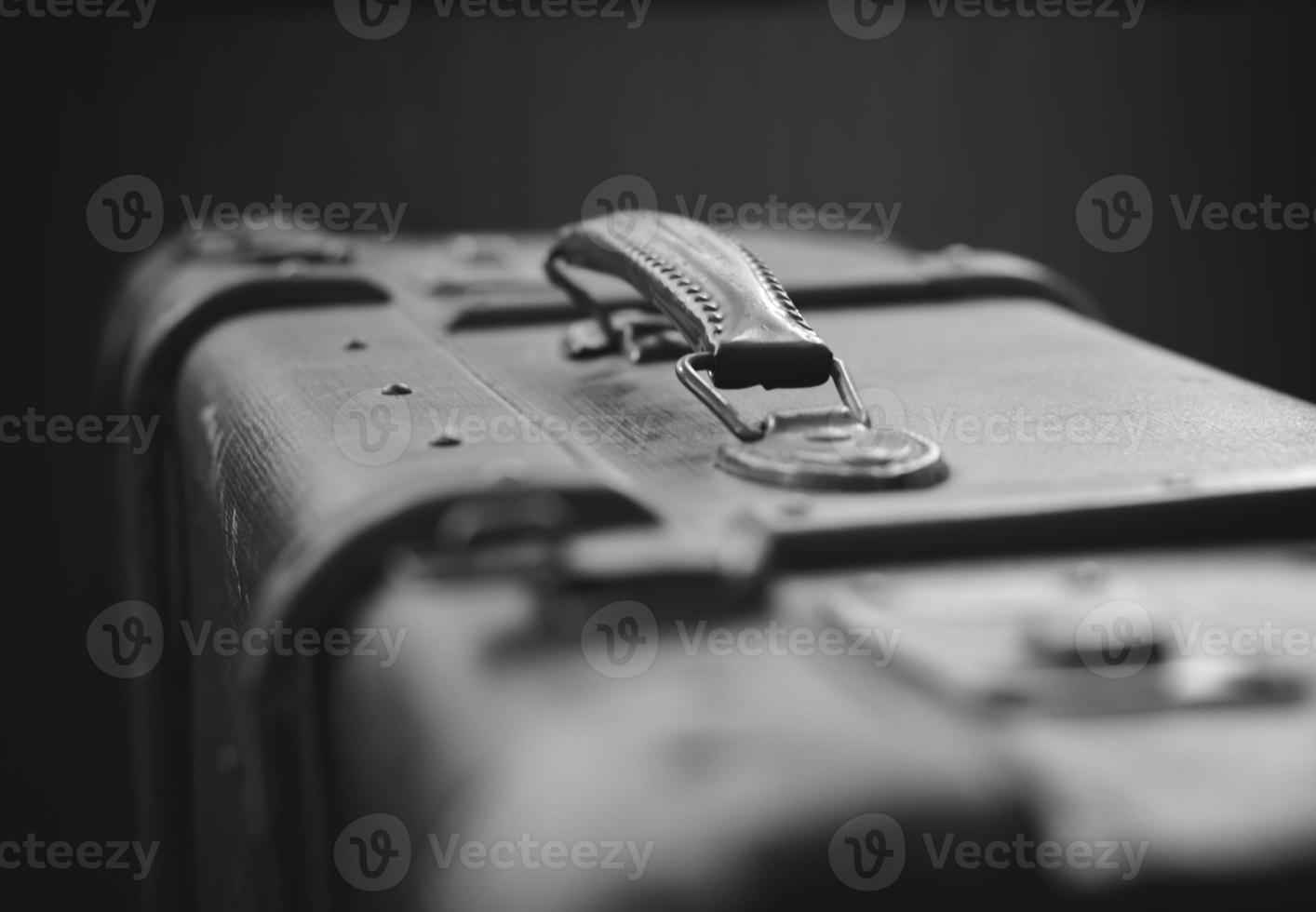 old suitcase in black and white photo