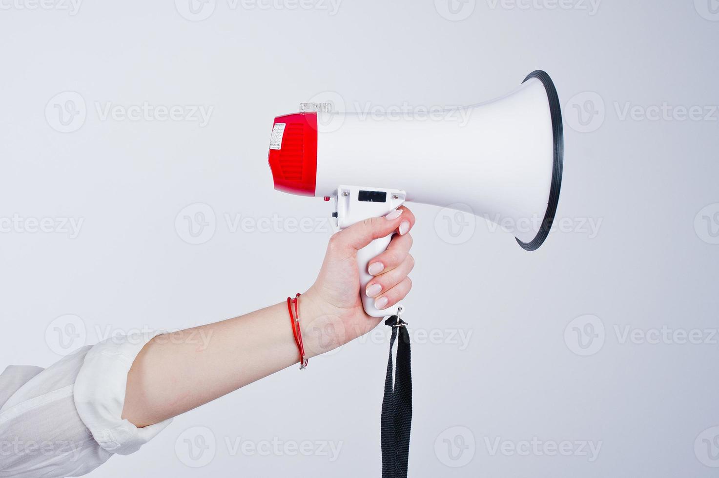 Close-up photo of the megaphone in female hand.