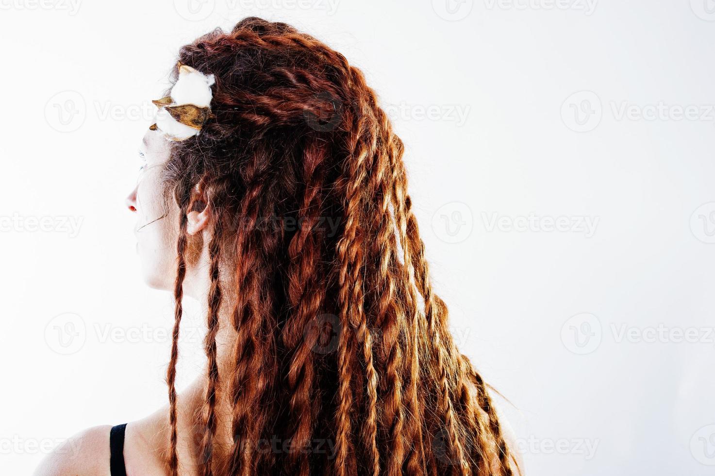 Studio shoot of back girl with dreads on white background. photo