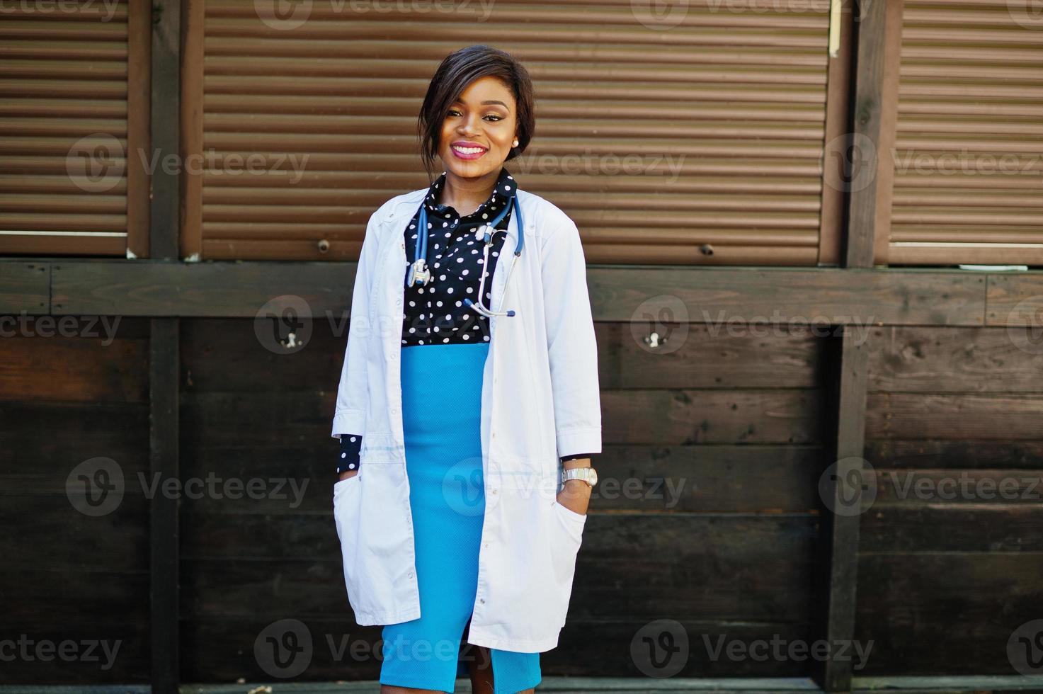 African american doctor female with stethoscope posed outdoor. photo