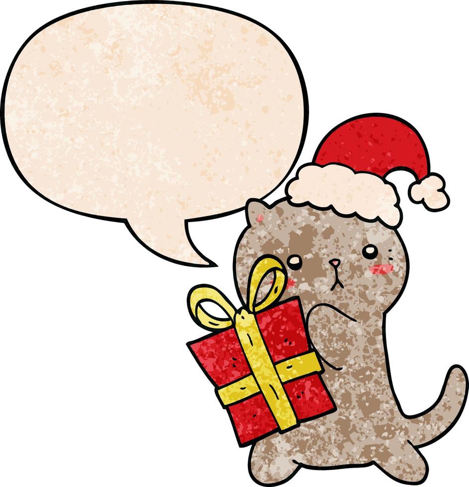 lindo gato de dibujos animados que lleva regalo de navidad y burbuja de habla en estilo de textura retro vector