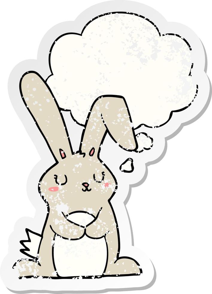cartoon rabbit and thought bubble as a distressed worn sticker vector