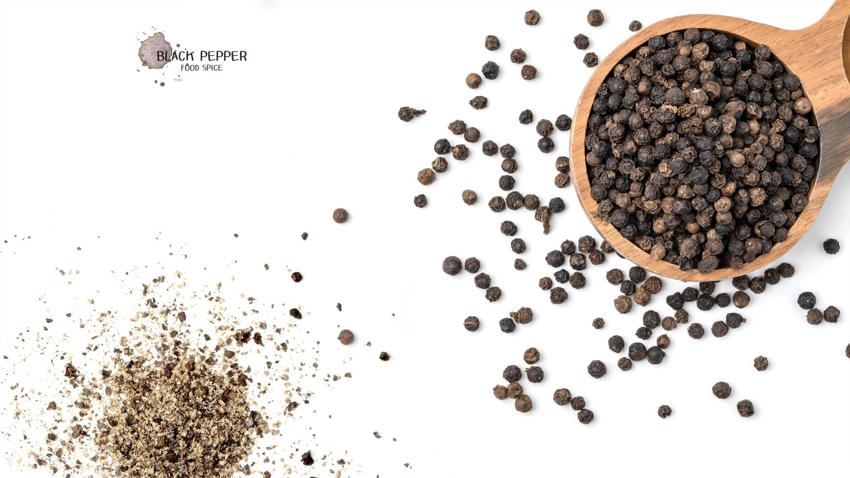 Black pepper seeds on white background. Food ingredients, spices