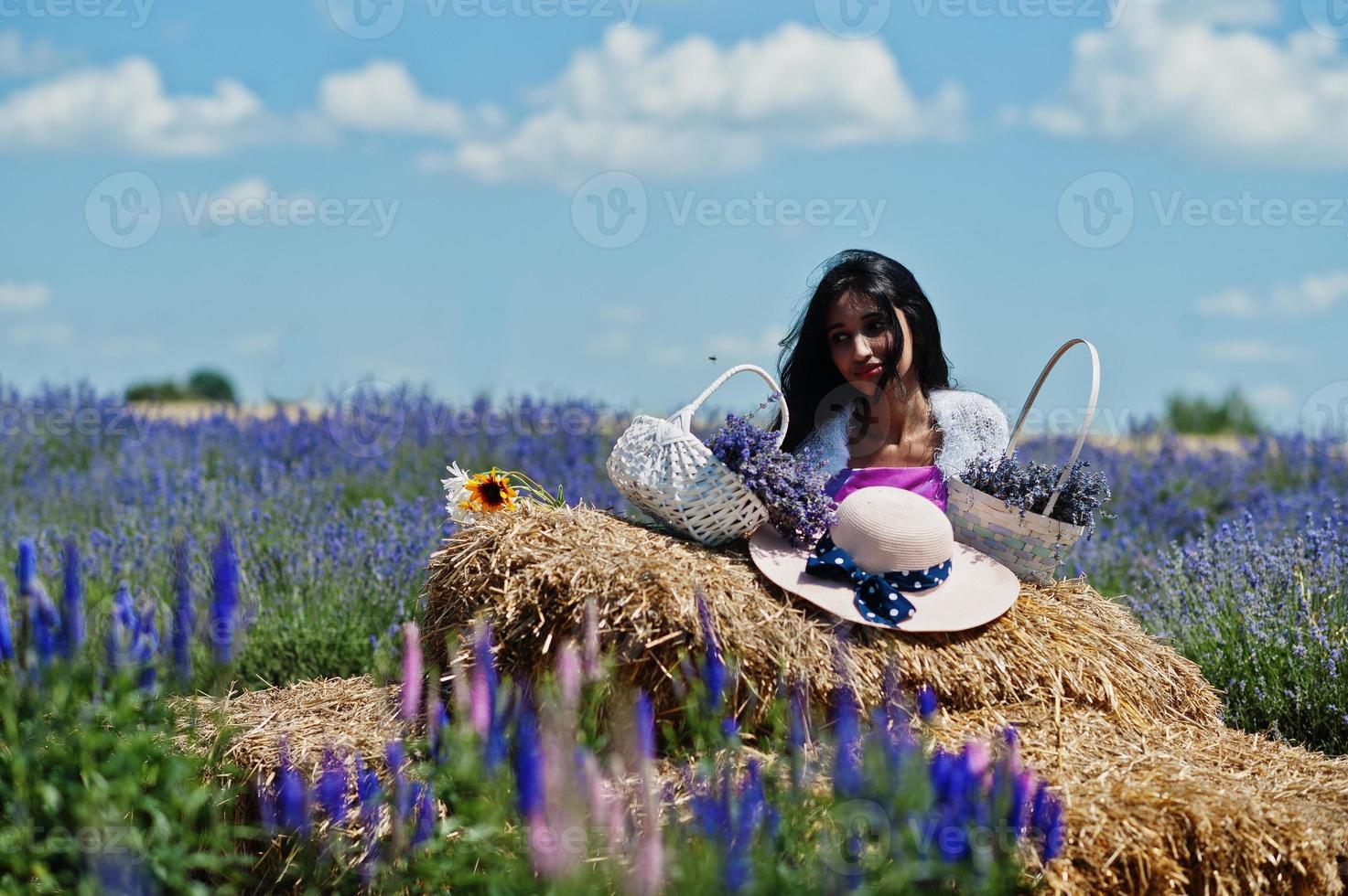 Beautiful indian girl wear saree india traditional dress in purple lavender field. photo