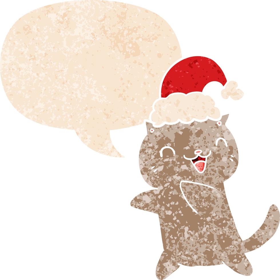 cute cartoon christmas cat and speech bubble in retro textured style vector