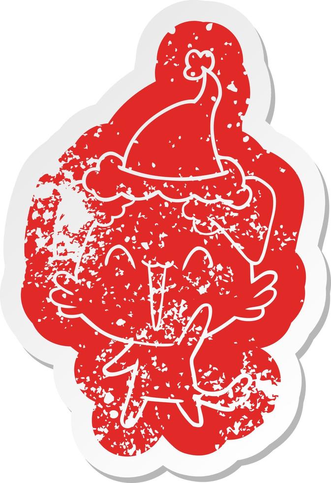happy little dog cartoon distressed sticker of a wearing santa hat vector
