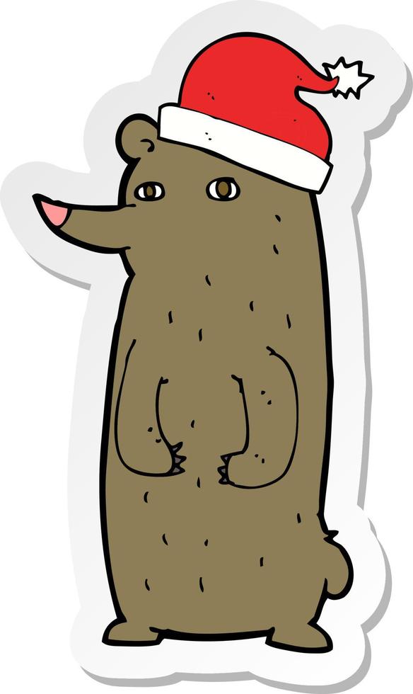 sticker of a cartoon bear in xmas hat vector