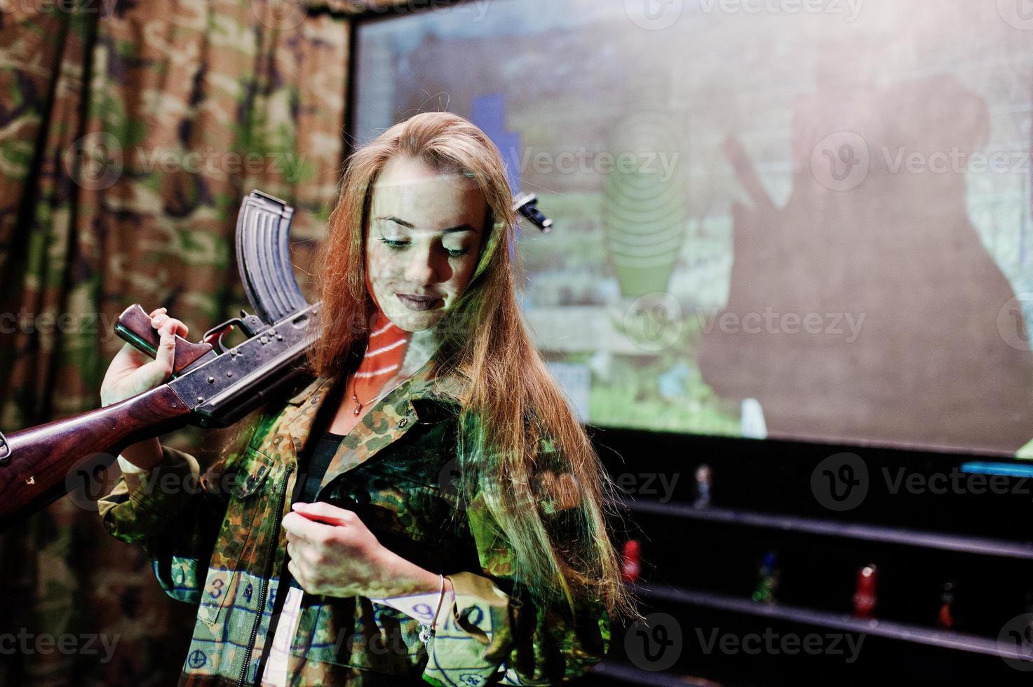 Girl with machine gun at hands on shooting range. photo