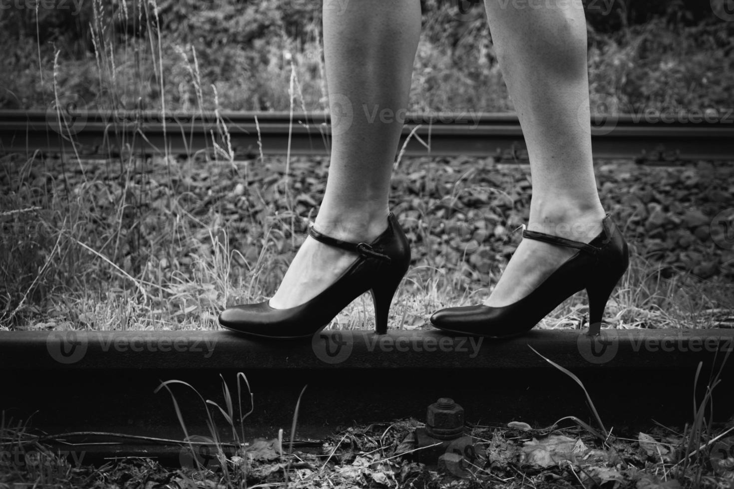 Woman with high heels on a railway track 10483824 Stock Photo at Vecteezy