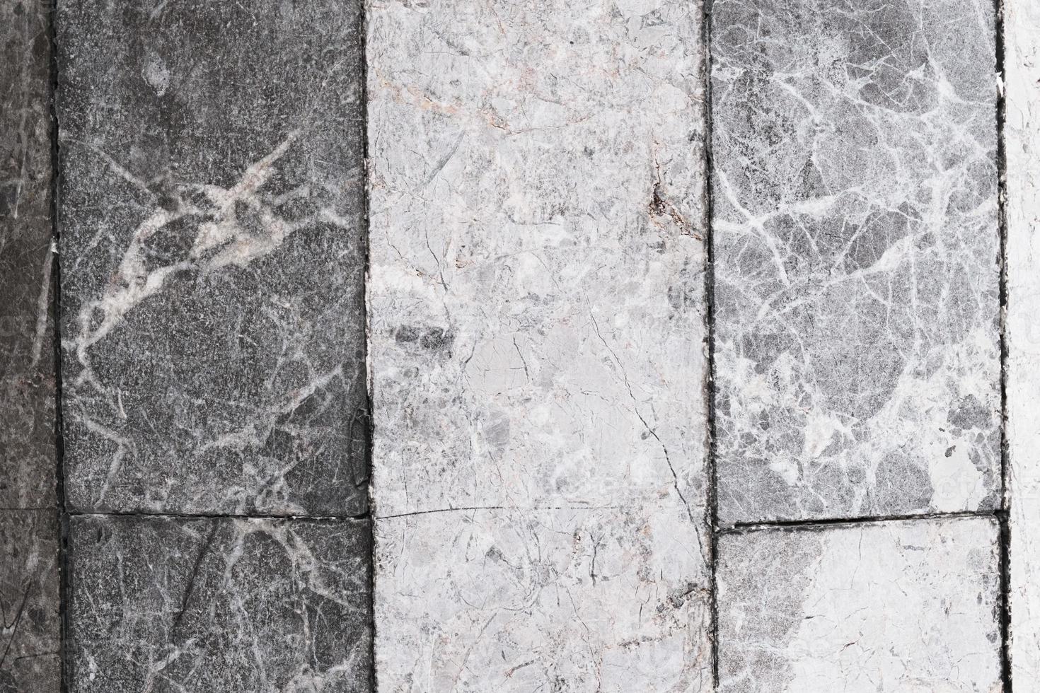 old weathered marble blocks, floor with stains and scratches, pattern and texture, colorful background, textured surface photo