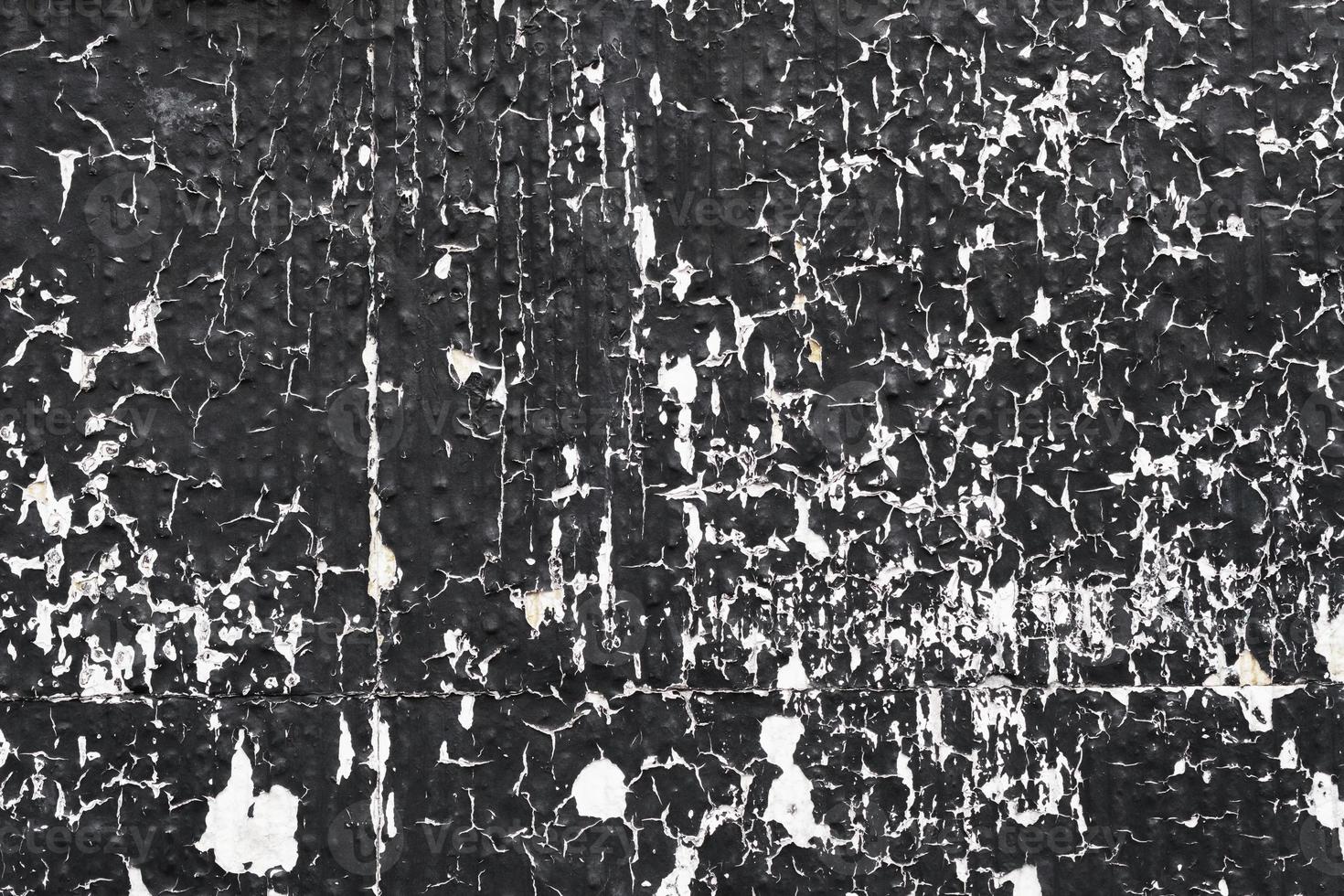 Black and white peeling wall texture, weathered textured surface, grunge background. photo
