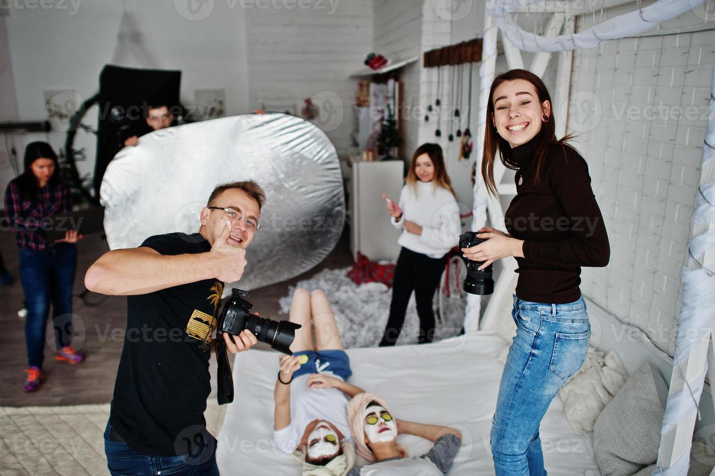 Work process of team photographer, designers and models stuff on photosession, master class of proffesionals. photo