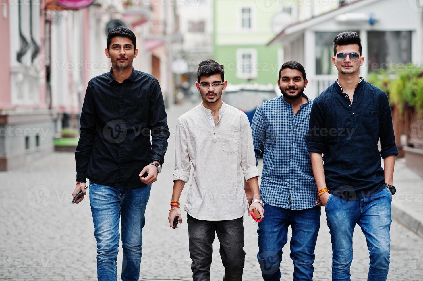 Group of four indian ethnicity friendship togetherness mans. photo