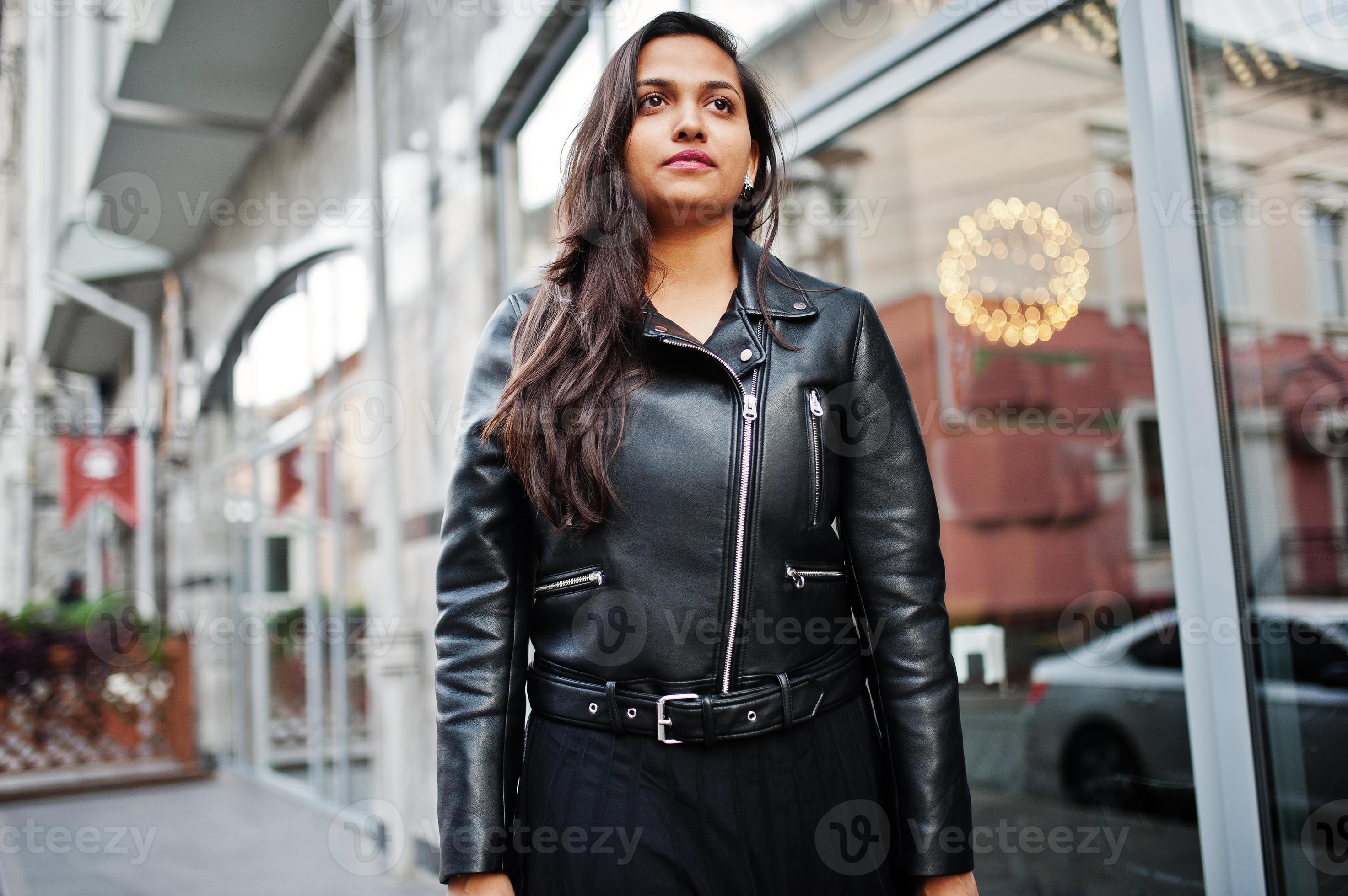 Pretty indian girl in black saree dress and leather jacket posed ...