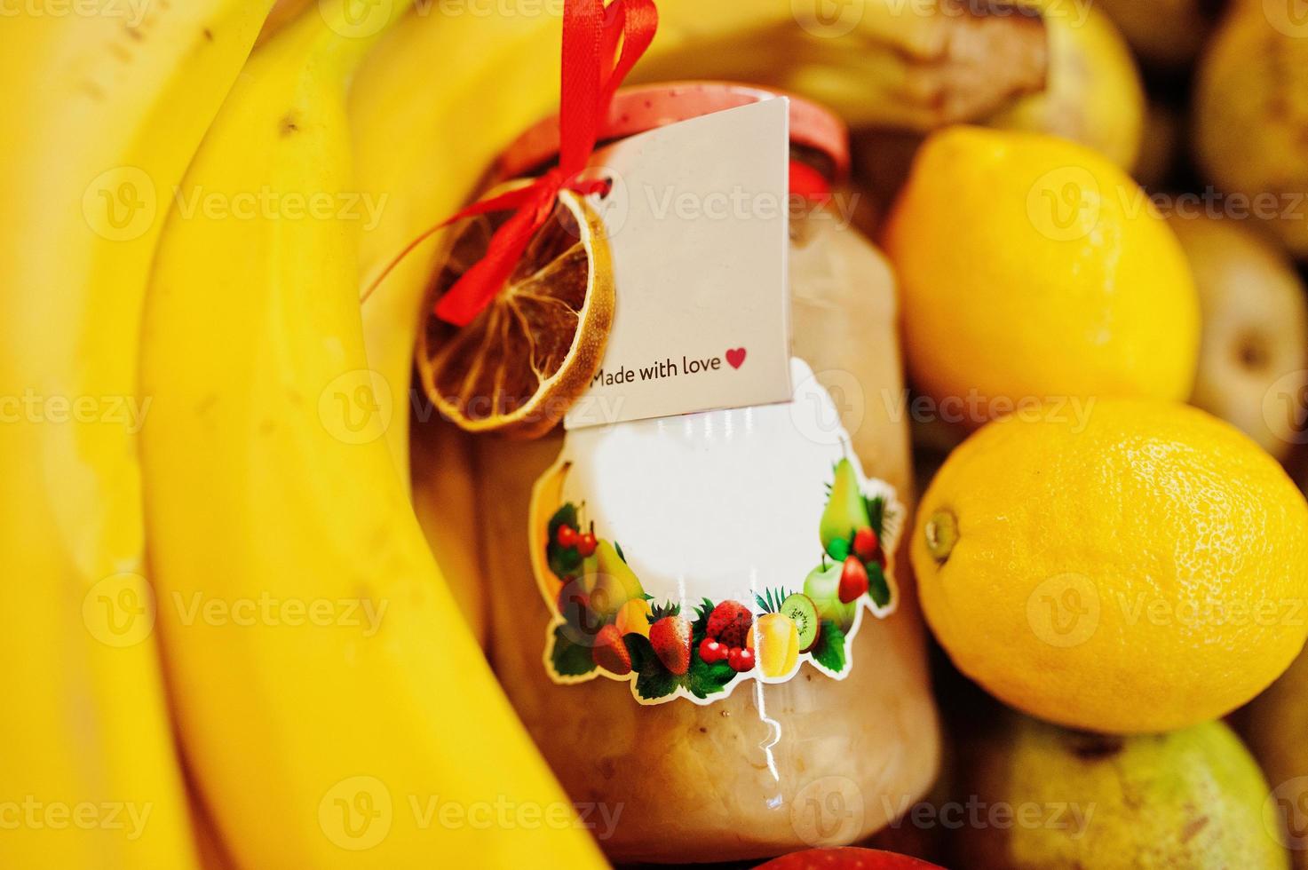 Hommemade jar with bananas on the shelf of a supermarket or grocery store. Made with love. photo