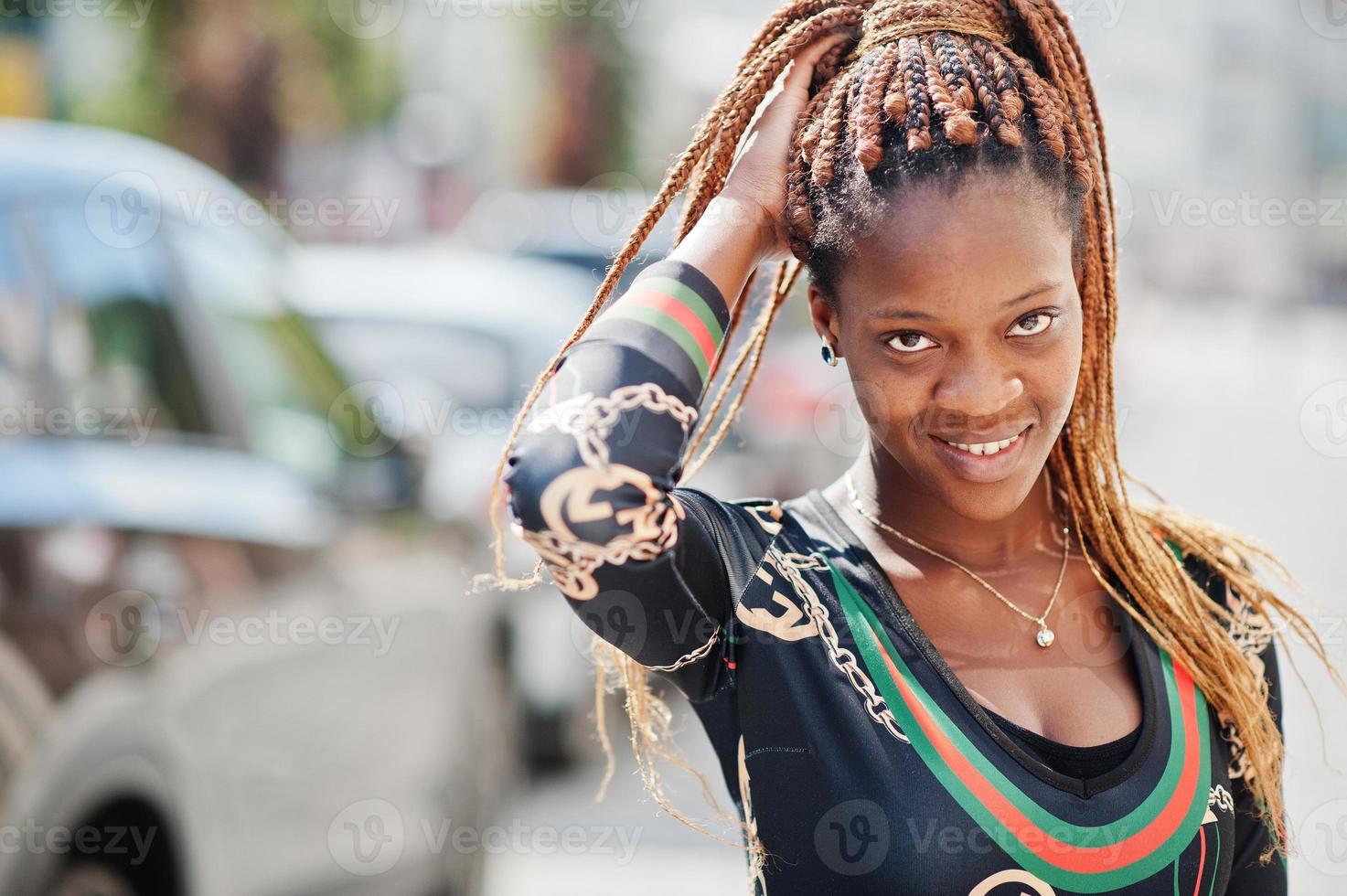 Portrait of handsome stylish african american model woman posed at street. photo